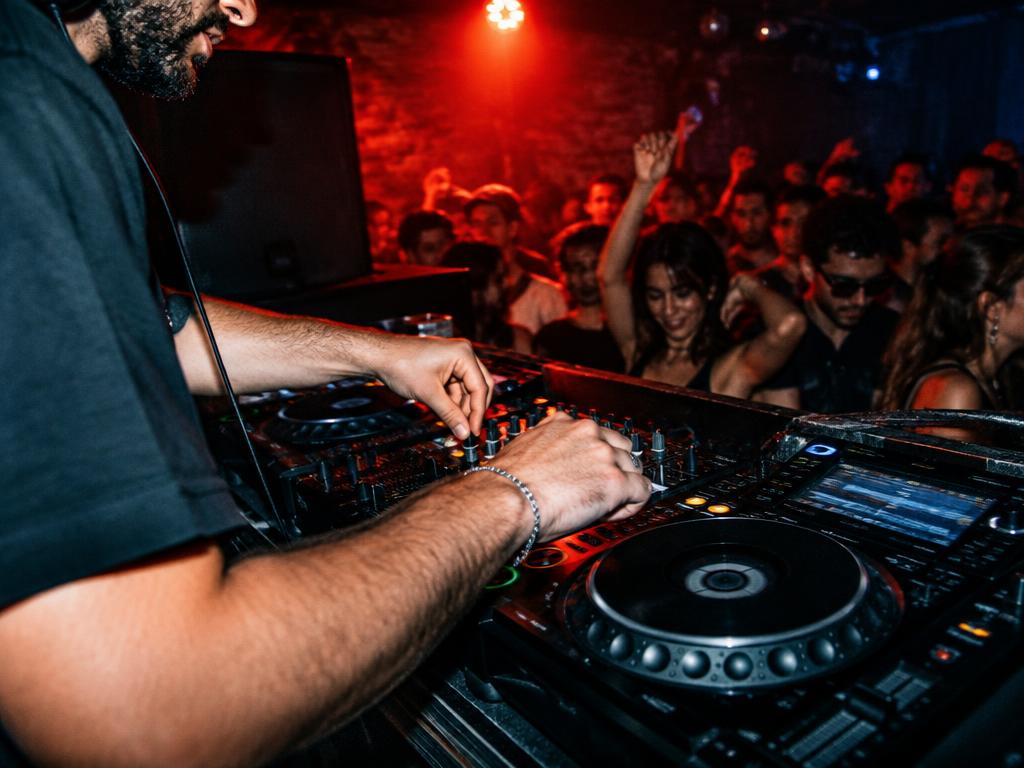 A DJ playing to an intimate club crowd