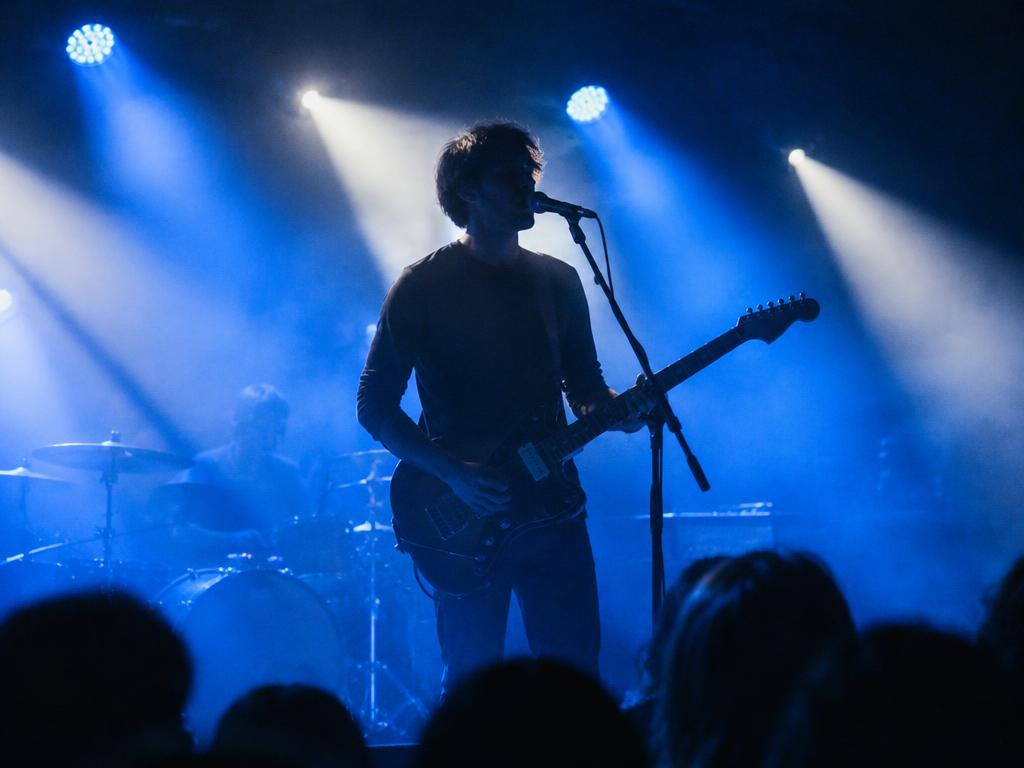 A singer and guitarist performing live